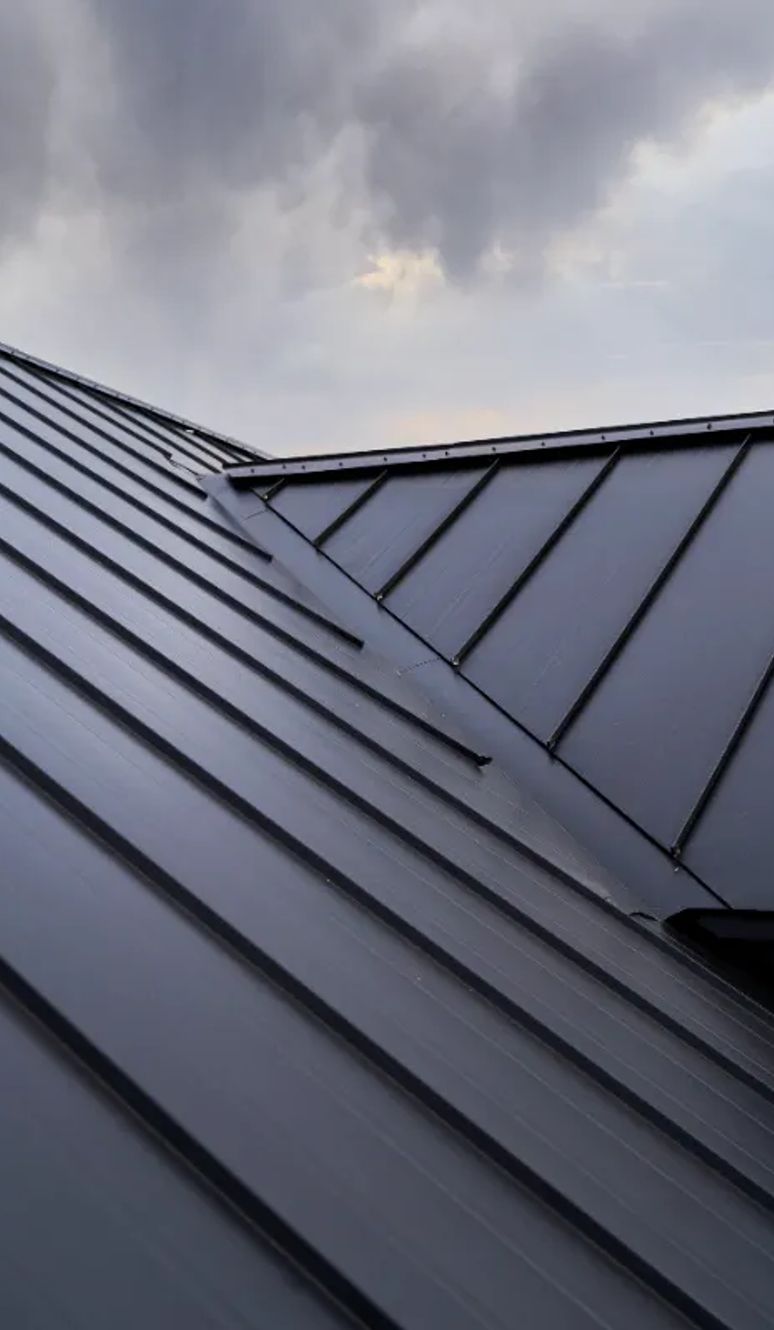 Standing seam metal roof in dark gray